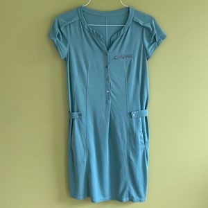Sage green poly knit dress with pockets and elastic waist and zipper detail.